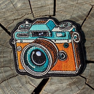 Geborduurde badge van een retro fototoestel
