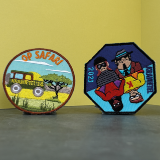 Badges speelplein krawietel Lede